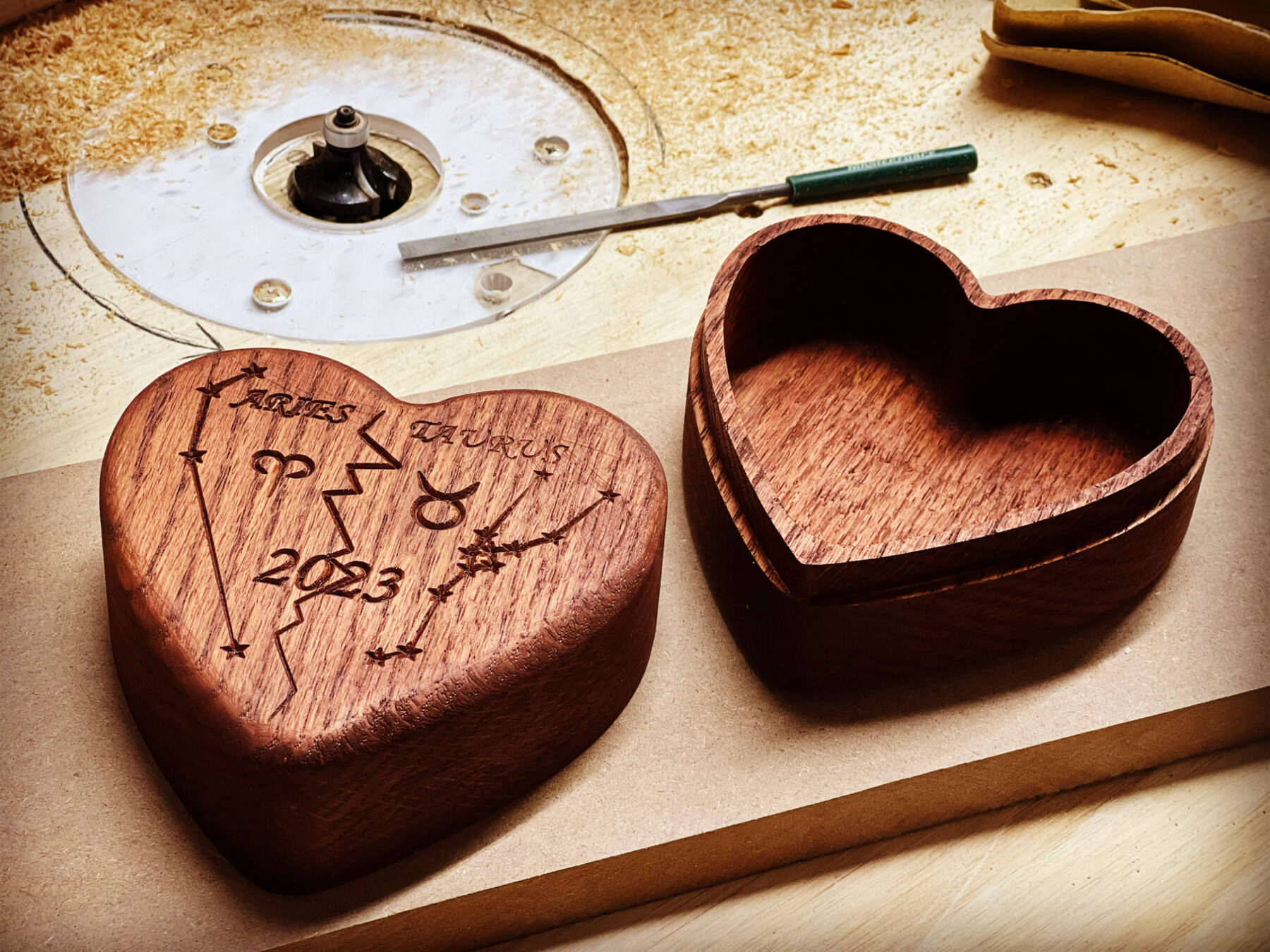 Heart-shaped keepsake box engraved with zodiac signs