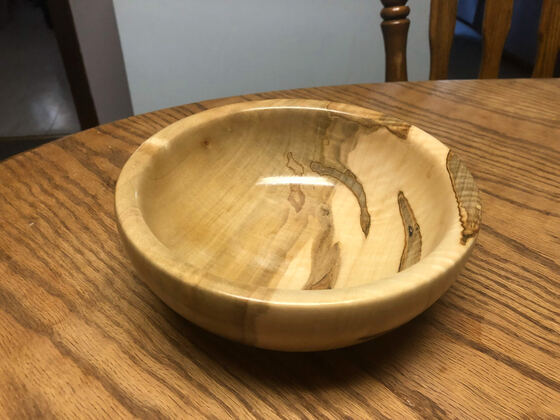 Turned spalted maple bowl on a table