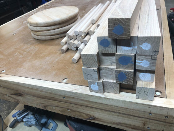 Stool components laid out on the bench