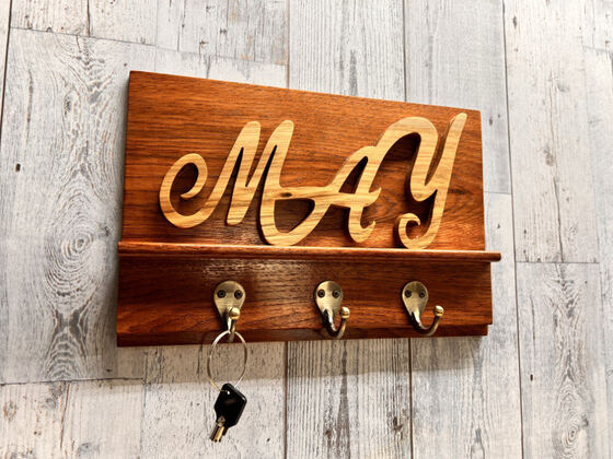 Family name key rack styled with keys on its hooks