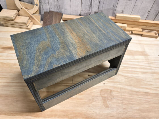 Blue-gray stained step stool from a top angle