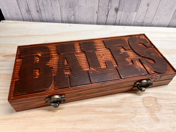 Carved keepsake box with two brass latches